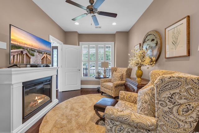 124 Turtle Creek Dr, Pawleys Island, SC 29585 - living area featuring dark wood finished floors, a ceiling fan, a glass covered fireplace, and recessed lighting