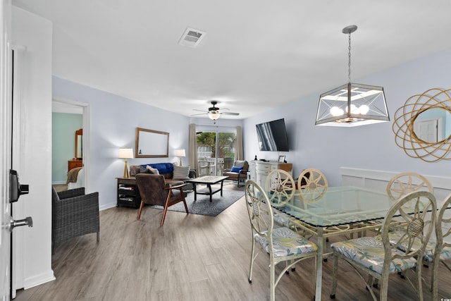 1217 S Ocean Blvd Unit 5, Surfside Beach, SC 29575 - dining area featuring ceiling fan and light wood-style flooring