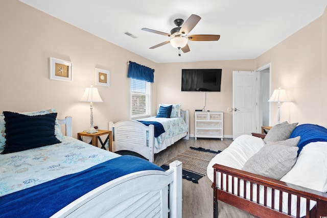 1217 S Ocean Blvd Unit 5, Surfside Beach, SC 29575 - bedroom featuring wood finished floors and ceiling fan