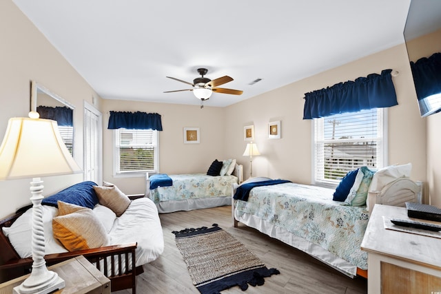 1217 S Ocean Blvd Unit 5, Surfside Beach, SC 29575 - bedroom featuring wood finished floors and ceiling fan