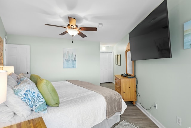 1217 S Ocean Blvd Unit 5, Surfside Beach, SC 29575 - bedroom featuring wood finished floors, a closet, and ceiling fan