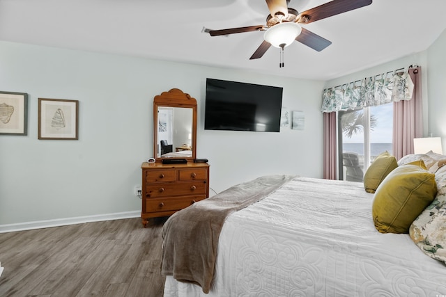 1217 S Ocean Blvd Unit 5, Surfside Beach, SC 29575 - bedroom with wood finished floors and a ceiling fan