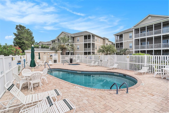 2000 Cross Gate Blvd Unit 202, Surfside Beach, SC 29575 - community pool with a patio area and an outdoor structure
