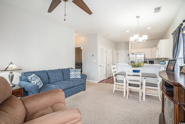 2000 Cross Gate Blvd Unit 202, Surfside Beach, SC 29575 - carpeted living room featuring a ceiling fan, a chandelier, and recessed lighting