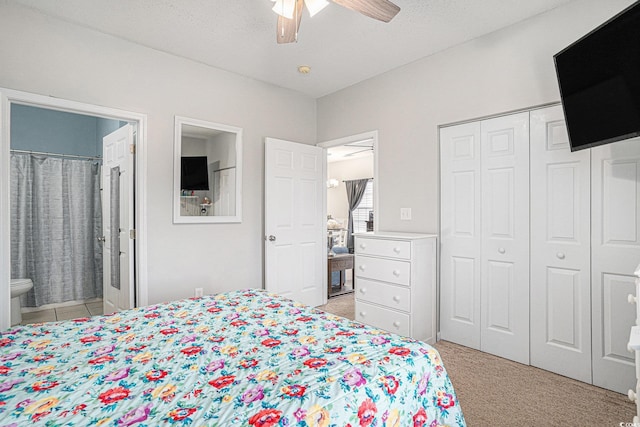 2000 Cross Gate Blvd Unit 202, Surfside Beach, SC 29575 - bedroom featuring light colored carpet, ensuite bath, a closet, and ceiling fan