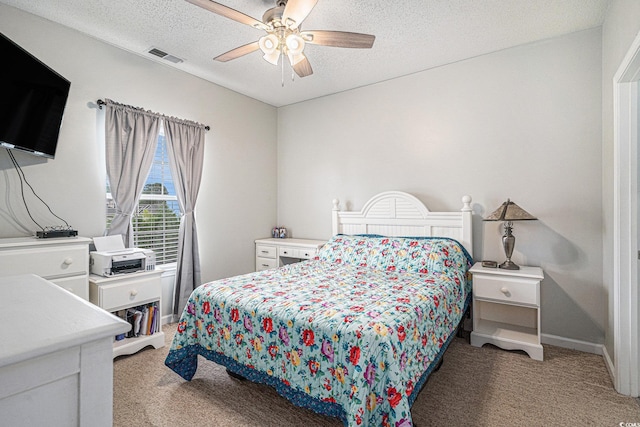 2000 Cross Gate Blvd Unit 202, Surfside Beach, SC 29575 - bedroom with light colored carpet, a textured ceiling, and a ceiling fan