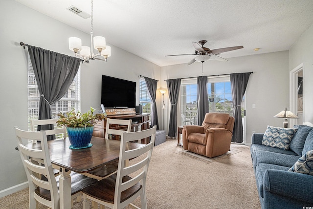 2000 Cross Gate Blvd Unit 202, Surfside Beach, SC 29575 - dining space with light carpet, a ceiling fan, a chandelier, and a textured ceiling