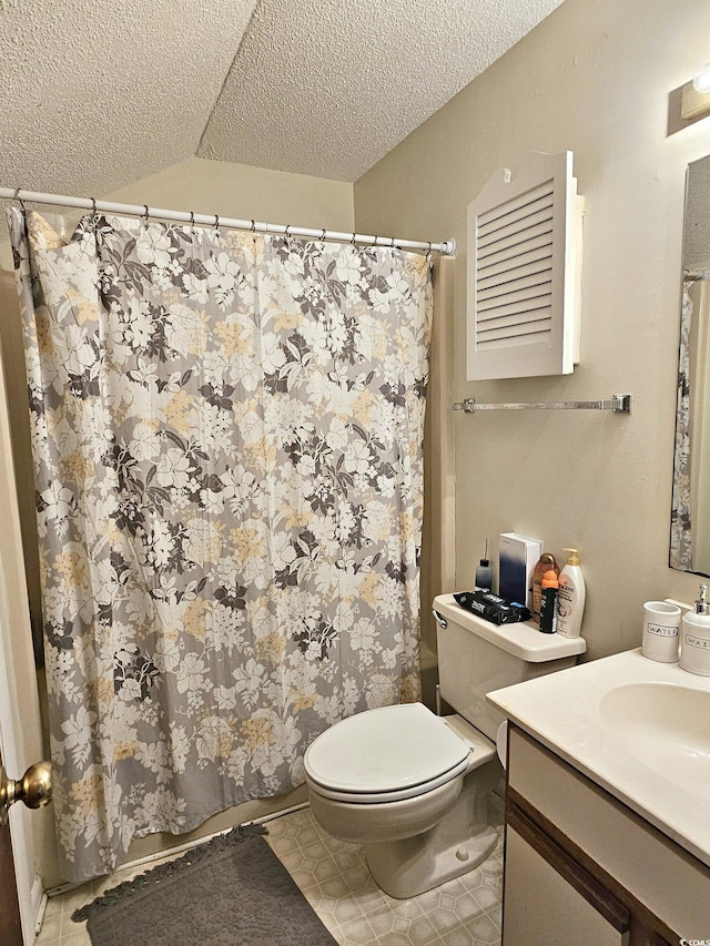 500 Fairway Village Dr Unit 9-K, Myrtle Beach, SC 29588 - bathroom with a textured ceiling, vanity, tile patterned flooring, and curtained shower