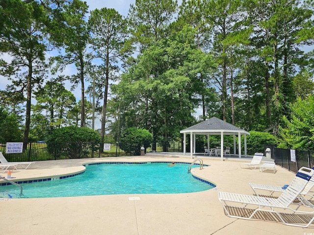 500 Fairway Village Dr Unit 9-K, Myrtle Beach, SC 29588 - community pool with a gazebo, a patio area, and view of scattered trees