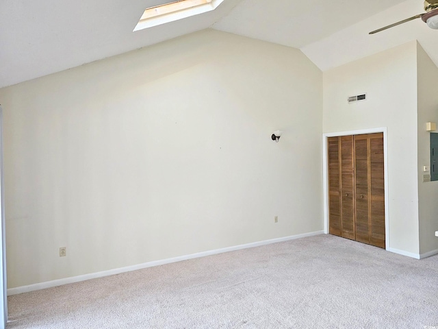 500 Fairway Village Dr Unit 9-K, Myrtle Beach, SC 29588 - unfurnished bedroom featuring a skylight, carpet, high vaulted ceiling, a closet, and ceiling fan