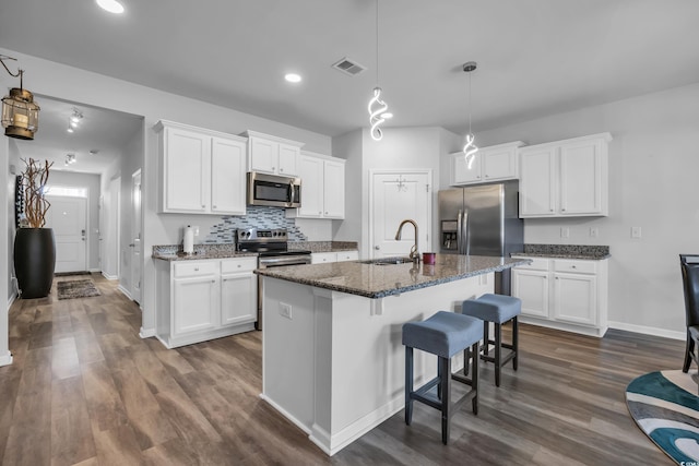 2882 Ophelia Way, Myrtle Beach, SC 29577 - kitchen with appliances with stainless steel finishes, dark wood finished floors, white cabinets, and recessed lighting
