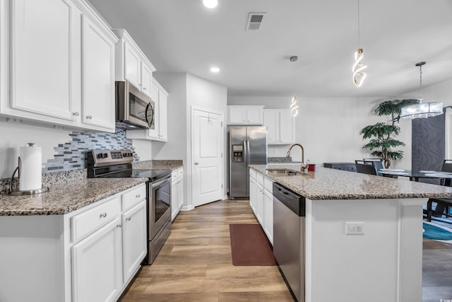 2882 Ophelia Way, Myrtle Beach, SC 29577 - kitchen with appliances with stainless steel finishes, white cabinets, tasteful backsplash, and recessed lighting