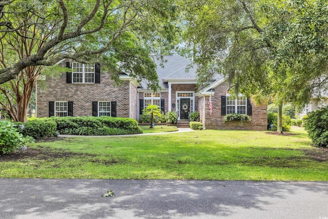 139 Olde Canal Loop, Pawleys Island, SC 29585 - view of front of property featuring brick siding and a front yard