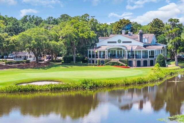 139 Olde Canal Loop, Pawleys Island, SC 29585 - back of property with a yard, a water view, golf course view, and view of wooded area