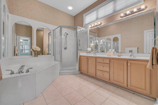 139 Olde Canal Loop, Pawleys Island, SC 29585 - bathroom with a garden tub, a stall shower, double vanity, tile patterned flooring, and wallpapered walls