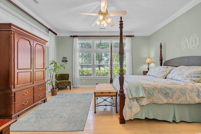 139 Olde Canal Loop, Pawleys Island, SC 29585 - bedroom with light wood-type flooring, crown molding, and a ceiling fan