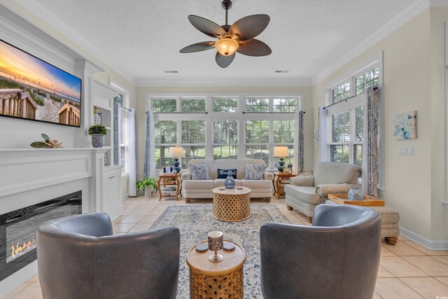 139 Olde Canal Loop, Pawleys Island, SC 29585 - living room featuring a fireplace, light tile patterned floors, crown molding, and ceiling fan
