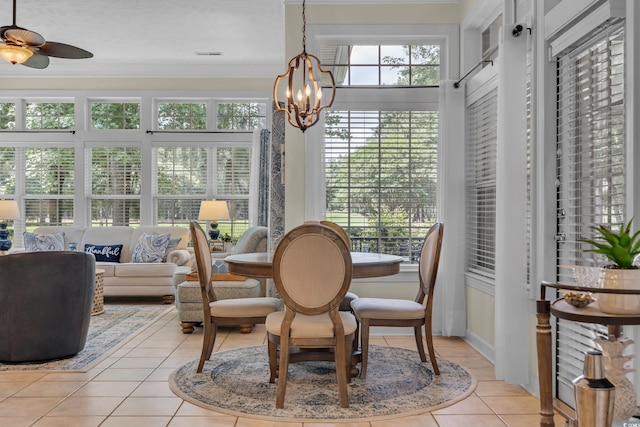 139 Olde Canal Loop, Pawleys Island, SC 29585 - sunroom featuring tile patterned floors, healthy amount of natural light, ornamental molding, and a chandelier