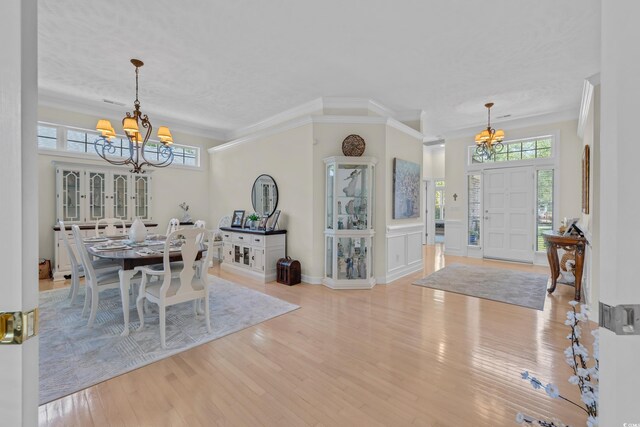 139 Olde Canal Loop, Pawleys Island, SC 29585 - dining area featuring a chandelier, wood finished floors, and crown molding