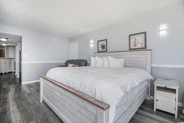 9550 Shore Dr Unit 1430, Myrtle Beach, SC 29572 - bedroom featuring a textured ceiling and dark wood-type flooring