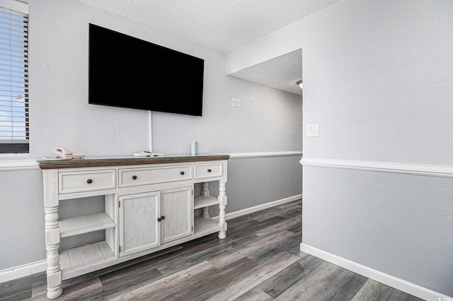 9550 Shore Dr Unit 1430, Myrtle Beach, SC 29572 - detailed view of a textured ceiling, wood finished floors, and a textured wall