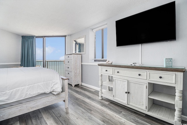 9550 Shore Dr Unit 1430, Myrtle Beach, SC 29572 - bedroom featuring baseboards and wood finished floors