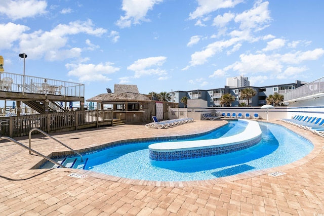 9550 Shore Dr Unit 1430, Myrtle Beach, SC 29572 - community pool with a patio area and an outbuilding