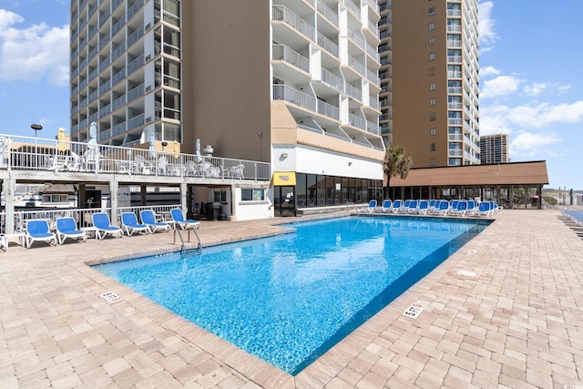 9550 Shore Dr Unit 1430, Myrtle Beach, SC 29572 - community pool featuring a patio area