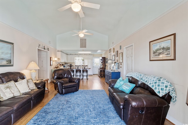 3307 Nixon St, North Myrtle Beach, SC 29582 - living area with ceiling fan, light wood-style flooring, and high vaulted ceiling