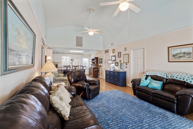 3307 Nixon St, North Myrtle Beach, SC 29582 - living room featuring a ceiling fan, light wood-type flooring, and vaulted ceiling