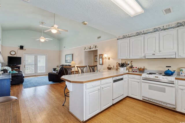 3307 Nixon St, North Myrtle Beach, SC 29582 - kitchen with white appliances, under cabinet range hood, a peninsula, a ceiling fan, and light wood-style floors