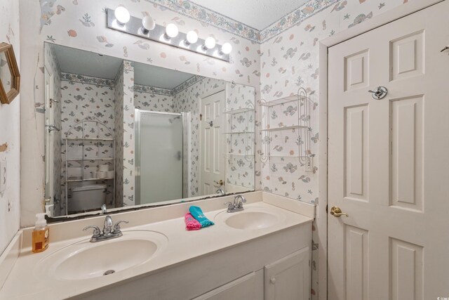 3307 Nixon St, North Myrtle Beach, SC 29582 - bathroom featuring wallpapered walls, a shower stall, and double vanity
