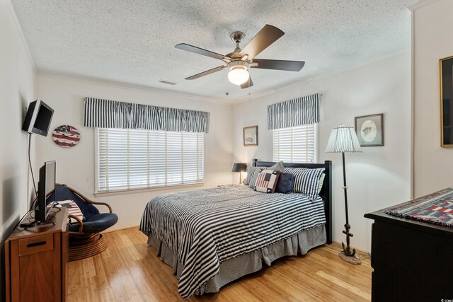 3307 Nixon St, North Myrtle Beach, SC 29582 - bedroom featuring wood finished floors, ornamental molding, a textured ceiling, and ceiling fan