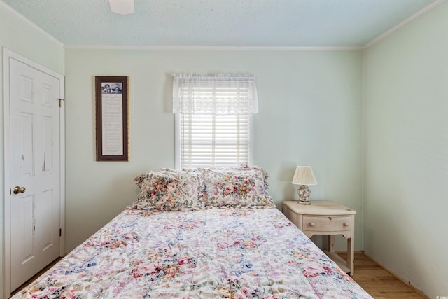 3307 Nixon St, North Myrtle Beach, SC 29582 - bedroom featuring crown molding, wood finished floors, and a ceiling fan
