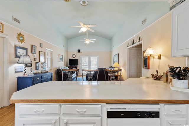 3307 Nixon St, North Myrtle Beach, SC 29582 - kitchen featuring a peninsula, ceiling fan, white cabinetry, dishwasher, and light wood finished floors