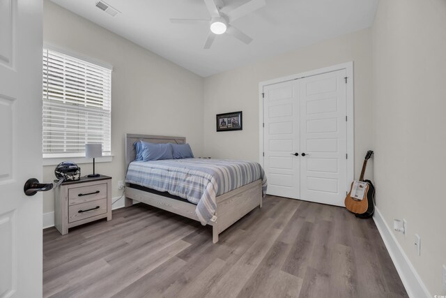 1024 Pochard Dr, Conway, SC 29526 - bedroom with light wood-style flooring, ceiling fan, and a closet