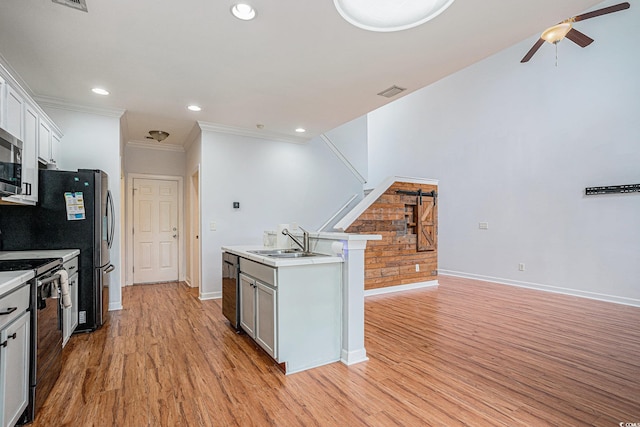 1120 Fairway Ln Unit 1120, Conway, SC 29526 - kitchen featuring stainless steel appliances, ceiling fan, light wood finished floors, light countertops, and recessed lighting