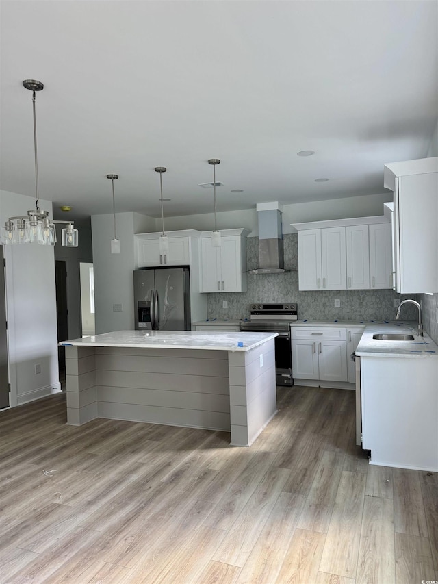 2075 Lees Landing Cir, Conway, SC 29526 - kitchen with appliances with stainless steel finishes, wall chimney range hood, a center island, backsplash, and light countertops