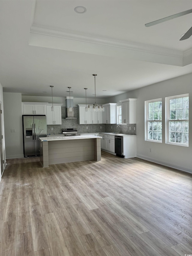 2075 Lees Landing Cir, Conway, SC 29526 - kitchen featuring appliances with stainless steel finishes, ornamental molding, a center island, light wood finished floors, and light countertops
