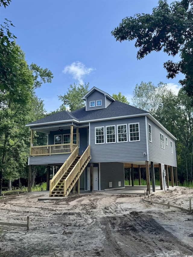 2075 Lees Landing Cir, Conway, SC 29526 - raised beach house featuring a carport, driveway, stairs, ceiling fan, and a shingled roof