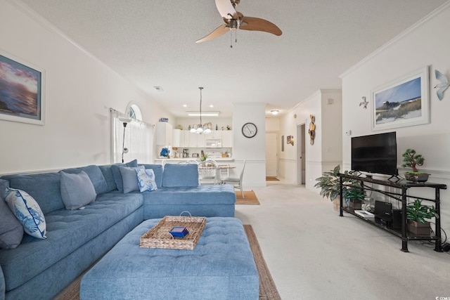 4261 Hibiscus Dr Unit 4-104, Little River, SC 29566 - living room with a chandelier, light colored carpet, ceiling fan, a wainscoted wall, and a textured ceiling