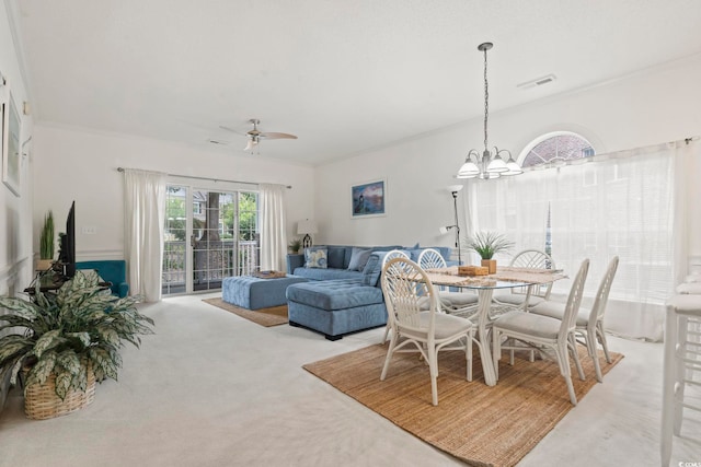 4261 Hibiscus Dr Unit 4-104, Little River, SC 29566 - carpeted dining room featuring a chandelier, ornamental molding, and a ceiling fan