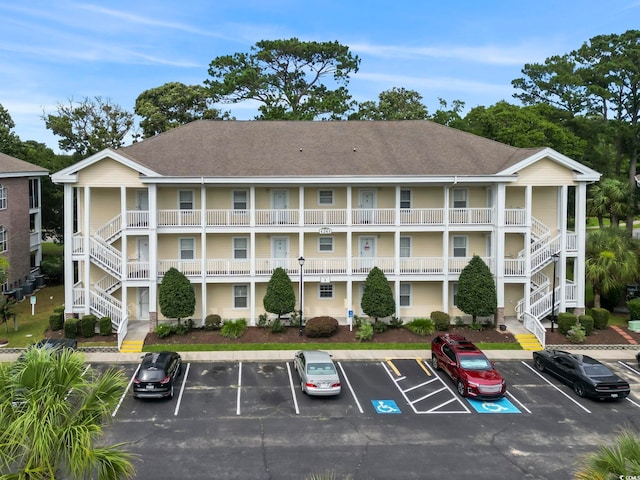 4261 Hibiscus Dr Unit 4-104, Little River, SC 29566 - view of building exterior with uncovered parking