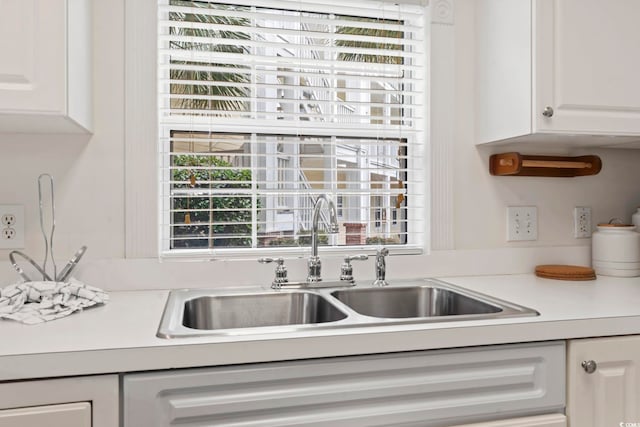 4261 Hibiscus Dr Unit 4-104, Little River, SC 29566 - kitchen featuring light countertops, white cabinetry, and plenty of natural light