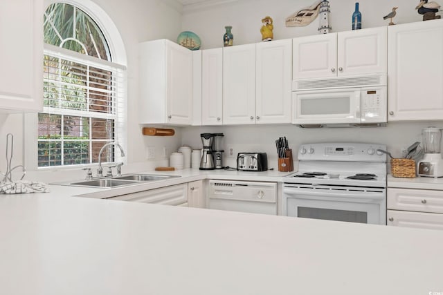 4261 Hibiscus Dr Unit 4-104, Little River, SC 29566 - kitchen with white appliances, ornamental molding, white cabinetry, and light countertops