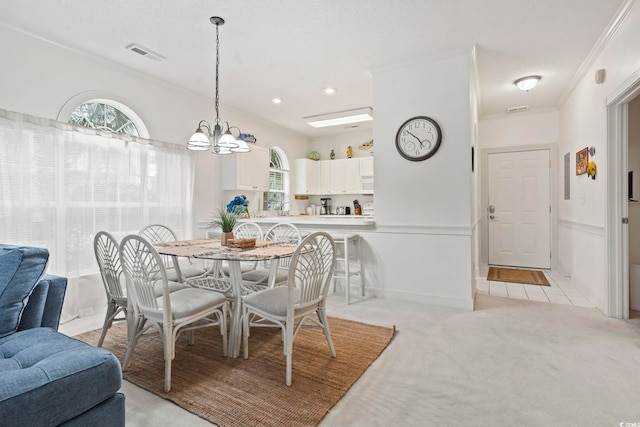 4261 Hibiscus Dr Unit 4-104, Little River, SC 29566 - dining room featuring healthy amount of natural light, ornamental molding, light carpet, a chandelier, and recessed lighting