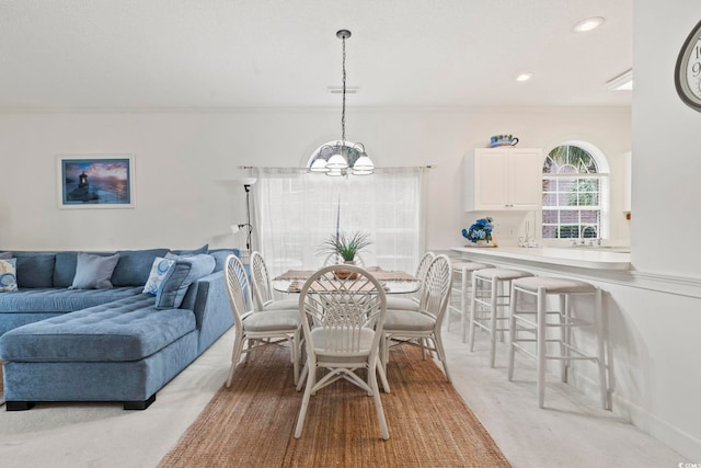 4261 Hibiscus Dr Unit 4-104, Little River, SC 29566 - dining space with a chandelier, recessed lighting, and light carpet