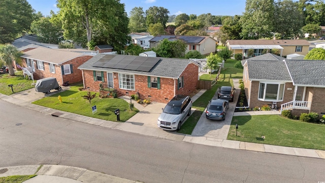 1145 Forest Dr, North Myrtle Beach, SC 29582 - view of front of home featuring brick siding, a residential view, crawl space, a front lawn, and concrete driveway