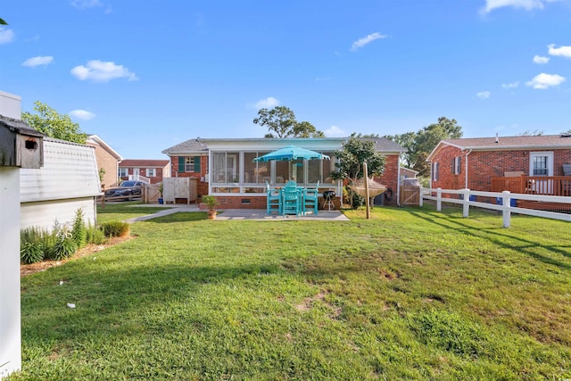 1145 Forest Dr, North Myrtle Beach, SC 29582 - back of house with a sunroom, brick siding, a patio, a gate, and a fenced backyard