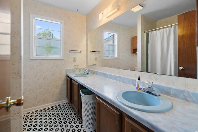 1145 Forest Dr, North Myrtle Beach, SC 29582 - bathroom with healthy amount of natural light, double vanity, wallpapered walls, and a shower with shower curtain